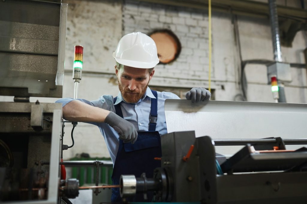 Engineer examining the machine